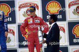 Michael Schumacher (GER) Ferrari 3rd position celebrate on podium with Pele'