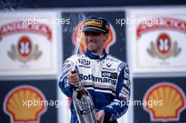 Damon Hill (GBR) Williams Renault 1st position celebrate on podium with Champagne