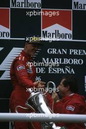 Michael Schumacher (GER) Ferrari 1st position celebrate podium with Jean Todt (FRA)