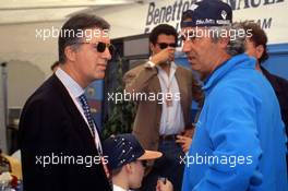 Piero Ferrari (ITA) talks with Flavio Briatore (ITA) Benetton