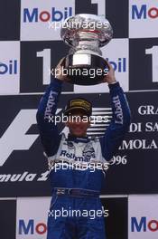 Damon Hill (GBR) Williams 1st position celebrates on podium