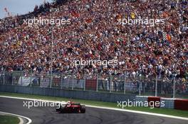 Michael Schumacher (GER) Ferrari F310 Scuderia Ferrari 2nd position at Tosa corner