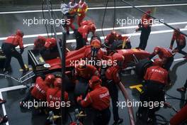 Michael Schumacher (GER) Ferrari F310 Scuderia Ferrari 1st position during a pit stop