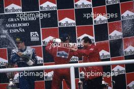 Michael Schumacher (GER) Ferrari 1st position celebrate podium with Jean Todt (FRA).Jacques Villeneuve (CDN) Williams 3rd position