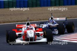 Mika Hakkinen (FIN) McLaren MP4/11 Mercedes leads Jacques Villeneuve (CDN) Williams FW18 Renault 2nd position