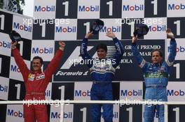 Michael Schumacher (GER) Ferrari 2nd position Damon Hill (GBR) Williams 1st position Gerhard Berger (AUT) Benetton 3rd position celebrate on podium