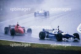 Jacques Villeneuve (CDN) Williams FW18 Renault Rothmans Williams Renault 3rd position leads Michael Schumacher (GER) Ferrari F310 Scuderia Ferrari 1st position