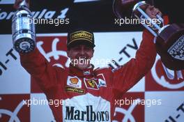 Michael Schumacher (GER) Scuderia Ferrari Marlboro 1st position celebrate victory on podium