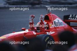 Michael Schumacher (GER) Ferrari F310B Scuderia Ferrari Marlboro 1st position celebrate victory