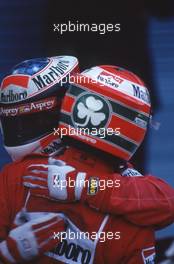 Michael Schumacher (GER) Scuderia Ferrari Marlboro 1st position celebrate victory with teammate Eddie Irvine (IRL) 3rd position