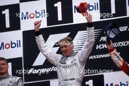 Mika Hakkinen (FIN) McLaren Mercedes 1st position celebrates podium