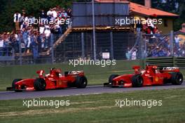 Michael Schumacher (GER) Ferrari F300 2nd position leads teammate Eddie Irvine (IRL) 3rd position