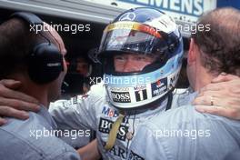 Mika Hakkinen (FIN) McLaren Mercedes 1st position celebrates victory with Adrian Newy