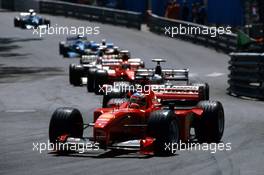 Michael Schumacher (GER) Ferrari F399 1st position lead a group