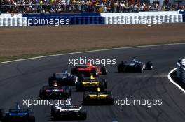Mika Hakkinen (FIN) McLaren MP4/14 Mercedes lead the group at second start