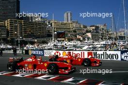 Michael Schumacher (GER) Ferrari F399 1st position and team-mate Eddie Irvine (IRL) 2nd position celebrate victory