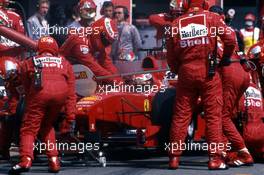 Michael Schumacher (GER) Ferrari F399 1st position during a pit stop