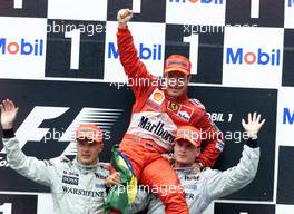 30.07.2000 Hockenheim, Deutschland, Mika Hakkinen, McLaren, Rubens Barrichello, Ferrari und David Coulthard, Ferrari heute auf dem Podium beim Formel 1 Grand Prix von Deutschland in Hockenheim.   c xpb.cc
