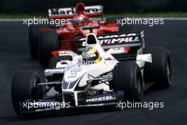 Ralf Schumacher (GER) Williams FW22 Bmw leads Michael Schumacher (GER) Ferrari F1 2000 3rd position