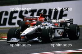 Mika Hakkinen (FIN) McLaren MP4/15 Mercedes 2nd position lead Michael Schumacher (GER) Ferrari F1 2000 1st position