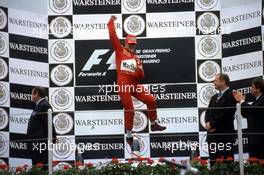 Michael Schumacher (GER) Ferrari 1st position celebrate victory on podium