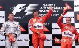 04.03.2001 Melbourne, Australien, David Coulthard, Michael Schumacher und Rubens Barrichllo bei Siegerehrung heute nach Schumachers Sieg beim Formel 1 Grand Prix im australischen Melbourne.  c xpb.cc