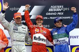 02.09.2001 Spa, Belgien, David Coulthard, Michael Schumacher und Giancarlo Fisichella bei Siegerehrung am Sonntag (02.09.2001) nach Schumachers Sieg beim Formel 1 Grand Prix von Belgien am Sonntag in Spa. c xpb.cc