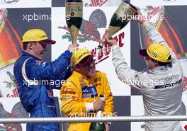 21.04.2002 Hockenheim, Deutschland, DTM, Sonntag in Hockenheim (kleiner Kurs), Podium nach dem Hauptrennen, Mattias Ekström 2ter, Laurent Aiello 1ter und Jean Alesi (AMG-Mercedes) 3ter, Podium c xpb.cc Email: info@xpb.cc, weitere Bilder auf der Datenbank: www.xpb.cc