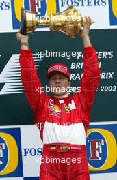 07.07.2002 Silverstone, England, F1 in Silverstone, Podium am Sonntag, Michael Schumacher 1ter, Formel 1 Grand Prix (GP) von England (Great Britain) in Silverstone 2002. c xpb.cc - weitere Bilder auf der Datenbank unter www.xpb.cc - Email: info@xpb.cc