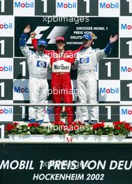 28.07.2002 Hockenheim, Deutschland, F1 am Hockenheimring, Podium am Sonntag, Juan Pablo Montoya, Michael Schumacher, Ralf Schumacher, Formel 1 Grand Prix (GP), Großer Preis von Deutschland 2002 (Baden Württemberg) c xpb.cc - weitere Bilder auf der Datenbank unter www.xpb.cc - Email: info@xpb.cc