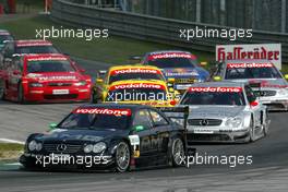 07.09.2003 Zeltweg, Österreich, Start of the race, Marcel Fässler (CHE), AMG-Mercedes, Mercedes-Benz CLK-DTM, leading the field through the first corner - DTM 2003 in Zeltweg, Grand-Prix-Kurs des A1-Ring, Österreich (Deutsche Tourenwagen Masters)  - Weitere Bilder auf www.xpb.cc, eMail: info@xpb.cc - Belegexemplare senden.  c Copyright: Kennzeichnung mit: Miltenburg / xpb.cc