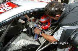 06.09.2003 Zeltweg, Österreich, Jean Alesi (FRA), AMG-Mercedes, hands Niki Lauda (AUT), former Formula One driver, a drinking bottle while he drives guest of Mercedes around the A1-Ring in the the Mercedes CLK two-seater DTM car - DTM 2003 in Zeltweg, Grand-Prix-Kurs des A1-Ring, Österreich (Deutsche Tourenwagen Masters)  - Weitere Bilder auf www.xpb.cc, eMail: info@xpb.cc - Belegexemplare senden.  c Copyright: Kennzeichnung mit: Miltenburg / xpb.cc