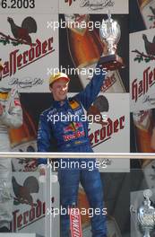 08.06.2003 Klettwitz, Deutschland, Podium, Mattias Ekström (SWE), PlayStation 2 Red Bull Abt-Audi, Portrait, holding up the trophy for first place - DTM 2003 in Klettwitz, EuroSpeedway Lausitz, Lausitzring (Deutsche Tourenwagen Masters)  - Weitere Bilder auf www.xpb.cc, eMail: info@xpb.cc - Belegexemplare senden. c Copyright: Kennzeichnung mit: Miltenburg / xpb.cc