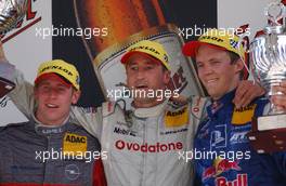 08.06.2003 Klettwitz, Deutschland, Podium, Bernd Schneider (GER), Vodafone AMG-Mercedes, Portrait (1st, center), Peter Dumbreck (GBR), OPC Team Phoenix, Portrait (2nd, left), and Mattias Ekström (SWE), PlayStation 2 Red Bull Abt-Audi, Portrait (3rd, right) - DTM 2003 in Klettwitz, EuroSpeedway Lausitz, Lausitzring (Deutsche Tourenwagen Masters)  - Weitere Bilder auf www.xpb.cc, eMail: info@xpb.cc - Belegexemplare senden. c Copyright: Kennzeichnung mit: Miltenburg / xpb.cc