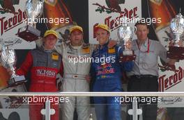 08.06.2003 Klettwitz, Deutschland, Podium, Bernd Schneider (GER), Vodafone AMG-Mercedes, Mercedes-Benz CLK-DTM (1st, center), Peter Dumbreck (GBR), OPC Team Phoenix, Opel Astra V8 Coupé (2nd, left), Mattias Ekström (SWE), PlayStation 2 Red Bull Abt-Audi, Abt-Audi TT-R (3rd, right), Hans-Jurgen Mattheis (GER), Team Manager HWA - DTM 2003 in Klettwitz, EuroSpeedway Lausitz, Lausitzring (Deutsche Tourenwagen Masters)  - Weitere Bilder auf www.xpb.cc, eMail: info@xpb.cc - Belegexemplare senden. c Copyright: Kennzeichnung mit: Miltenburg / xpb.cc