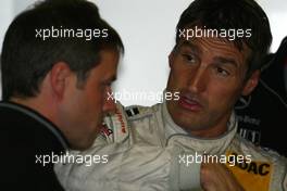 04.10.2003 Hockenheim, Deutschland, Bernd Schneider (GER), Vodafone AMG-Mercedes, Portrait, explaining the handling of his car to Gerhard Ungar (GER), Chief Designer AMG - DTM 2003 in Hockenheim, Grand-Prix-Kurs des Hockenheimring Baden-Württemberg (Deutsche Tourenwagen Masters)  - Weitere Bilder auf www.xpb.cc, eMail: info@xpb.cc - Belegexemplare senden.  c Copyright: Kennzeichnung mit: Miltenburg / xpb.cc