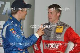 10.05.2003 Adria, Italien, Mattias Ekström (SWE), PlayStation 2 Red Bull Abt-Audi, Abt-Audi TT-R and Peter Dumbreck (GBR), OPC Team Phoenix, Opel Astra V8 Coupé discuss the result of the Super Pole Qualifying - DTM 2003 in Adria, Adria International Raceway (Deutsche Tourenwagen Masters)  - Weitere Bilder auf www.xpb.cc, eMail: info@xpb.cc - Belegexemplare senden. c Copyright: Kennzeichnung mit: Miltenburg / xpb.cc