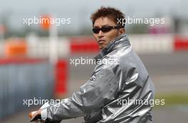 23.05.2003 Nürburg, Deutschland, Katsutomo Kaneishi (JPN), ARTA AMG-Mercedes, Portrait, looking at his collegues on the track from a scooter - DTM 2003 in Nürburg, Grand-Prix-Kurs des Nürburgring (Deutsche Tourenwagen Masters)  - Weitere Bilder auf www.xpb.cc, eMail: info@xpb.cc - Belegexemplare senden. c Copyright: Kennzeichnung mit: Miltenburg / xpb.cc