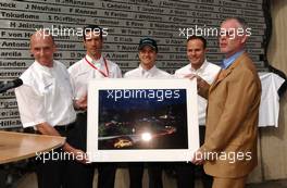 16.08.2003 Nürburg, Deutschland, Volker Strycek (GER), Opel Motosport Director, hands over a photo to Dr. Walter Kafitz (GER), Chief Executive Officer Nürburgring GmbH, to remember the Opel victory. In the back the other winner drivers, from left to right: Manuel Reuter (GER), OPC Team Holzer, Timo Scheider (GER), OPC Team Phoenix, and Marcel Tiemann (GER). Revealing of the winners names of the Nürburgring 24Hrs race - DTM 2003 in Nürburg, Grand-Prix-Kurs des Nürburgring (Deutsche Tourenwagen Masters)  - Weitere Bilder auf www.xpb.cc, eMail: info@xpb.cc - Belegexemplare senden. c Copyright: Kennzeichnung mit: Miltenburg / xpb.cc