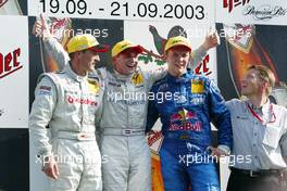 21.09.2003 Zandvoort, Niederlande, Podium, Christijan Albers (NED), Express-Service AMG-Mercedes, Portrait (1st, center), Bernd Schneider (GER), Vodafone AMG-Mercedes, Portrait (2nd, left), and Mattias Ekström (SWE), PlayStation 2 Red Bull Abt-Audi, Portrait (3rd, right) - DTM 2003 in Zandvoort, Grand-Prix-Kurs des Circuit Park Zandvoort, Niederlande, The Netherlands (Deutsche Tourenwagen Masters)  - Weitere Bilder auf www.xpb.cc, eMail: info@xpb.cc - Belegexemplare senden.  c Copyright: Kennzeichnung mit: Miltenburg / xpb.cc