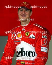 07.02.2003 Maranello, Italien, Ferrari, offizielle Formel1 Präsentation (Launch des F2003-GA), Scuderia Ferrari Marlboro, in der neuen Logistik-Halle auf dem Gelände von Ferrari, hier: Michael Schumacher, Portrait, lächelt - (Februar, Mugello, Italy, Formel 1, F1, 2003)  c Copyright: Photos mit - xpb.cc - kennzeichnen, weitere Bilder auf der Bilddatenbank