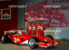 07.02.2003 Maranello, Italien, Ferrari, offizielle Formel1 Präsentation (Launch des F2003GA), Scuderia Ferrari Marlboro, in der neuen Logistik-Halle auf dem Gelände von Ferrari, hier: Felipe Massa, Rubens Barrichello, Michael Schumacher und Luca Bodoer - (Februar, Mugello, Italy, Formel 1, F1, 2003)  c Copyright: Photos mit - xpb.cc - kennzeichnen, weitere Bilder auf der Bilddatenbank