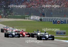 03.08.2003 Hockenheim, Deutschland, F1 am Hockenheimring, Start zum GP von Deutschland, CRASH / Unfall von Kimi Raikkonen, (Räikkönen, FIN, 06), West McLaren Mercedes, MP4-17D, auf der Strecke (Track) hinten Rubens Barrichello (BR, Ferrari)  - Sonntag, Formel 1 Grand Prix (GP), Großer Preis von Deutschland 2003 (Länge 4.574m, Baden Württemberg) -  LEGAL NOTICE: THIS PICTURE IS NOT FOR UK (Great Britain, England...) PRINT USE, KEINE PRINT BILDNUTZUNG IN ENGLAND! - Alle Bilder auf www.xpb.cc, eMail: info@xpb.cc - Abdruck ist honorarpflichtig. c Copyrightnachweis: xpb.cc