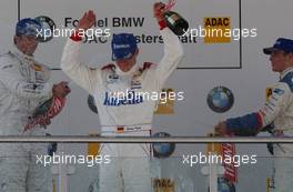 08.06.2003 Klettwitz, Deutschland, Podium, winner Robert Kath (GER), ADAC Sachsen e.V., gets a champaign shower from Timo Lienemann (GER), Mücke Motorsport, and Maximilian Götz (GER), Mücke Motorsport - Formel BMW ADAC Meisterschaft 2003 in Klettwitz, EuroSpeedway Lausitz, Lausitzring (Formel BMW ADAC Meisterschaft)  - Weitere Bilder auf www.xpb.cc, eMail: info@xpb.cc - Belegexemplare senden. c Copyright: Kennzeichnung mit: Miltenburg / xpb.cc
