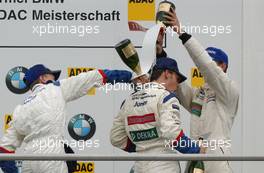 27.04.2003 Hockenheim, Deutschland, Podium, Maximilian Götz (GER), Mücke Motorsport gets a champaign shower from Sebastian Vettel (GER), Eifelland Racing and Robert Kath (GER), ADAC Sachsen e.V. - Formel BMW ADAC Meisterschaft 2003 in Hockenheim, Grand-Prix-Kurs des Hockenheimring Baden-Württemberg (Formel BMW ADAC Meisterschaft)  - Weitere Bilder auf www.xpb.cc, eMail: info@xpb.cc - Belegexemplare senden. c Copyright: Kennzeichnung mit: Miltenburg / xpb.cc