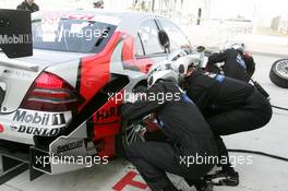 14.05.2004 Adria, Italy,  DTM, Friday, Mechanics changing a tyre during a pitstop practice of Bernd Schneider (GER), Vodafone AMG-Mercedes, AMG-Mercedes C-Klasse - DTM Season 2004 at Adria International Raceway (Deutsche Tourenwagen Masters, Italy)