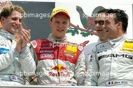 16.05.2004 Adria, Italy,  DTM, Sunday, Podium, Mattias Ekström (SWE), Audi Sport Team Abt, Portrait (1st, center), Christijan Albers (NED), DaimlerChrysler Bank AMG-Mercedes, Portrait (2nd, left) and Jean Alesi (FRA), AMG-Mercedes, Portrait (3rd, right). In the background Hans-Jurgen Abt (GER), Teamchef Abt-Audi - DTM Season 2004 at Adria International Raceway (Deutsche Tourenwagen Masters, Italy)