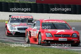 16.05.2004 Adria, Italy,  DTM, Sunday, Heinz-Harald Frentzen (GER), OPC Team Holzer, Opel Vectra GTS V8, in a close fight with Bernd Schneider (GER), Vodafone AMG-Mercedes, AMG-Mercedes C-Klasse - DTM Season 2004 at Adria International Raceway (Deutsche Tourenwagen Masters, Italy)