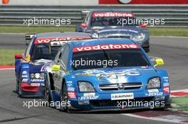 16.05.2004 Adria, Italy,  DTM, Sunday, Manuel Reuter (GER), OPC Team Holzer, Opel Vectra GTS V8, holding up front runners Mattias Ekström (SWE), Audi Sport Team Abt, Audi A4 DTM and Christijan Albers (NED), DaimlerChrysler Bank AMG-Mercedes, AMG-Mercedes C-Klasse - DTM Season 2004 at Adria International Raceway (Deutsche Tourenwagen Masters, Italy)