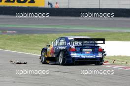 16.05.2004 Adria, Italy,  DTM, Sunday, Mattias Ekström (SWE), Audi Sport Team Abt, Audi A4 DTM, driving around the body parts of the car of Heinz-Harald Frentzen (GER) - DTM Season 2004 at Adria International Raceway (Deutsche Tourenwagen Masters, Italy)